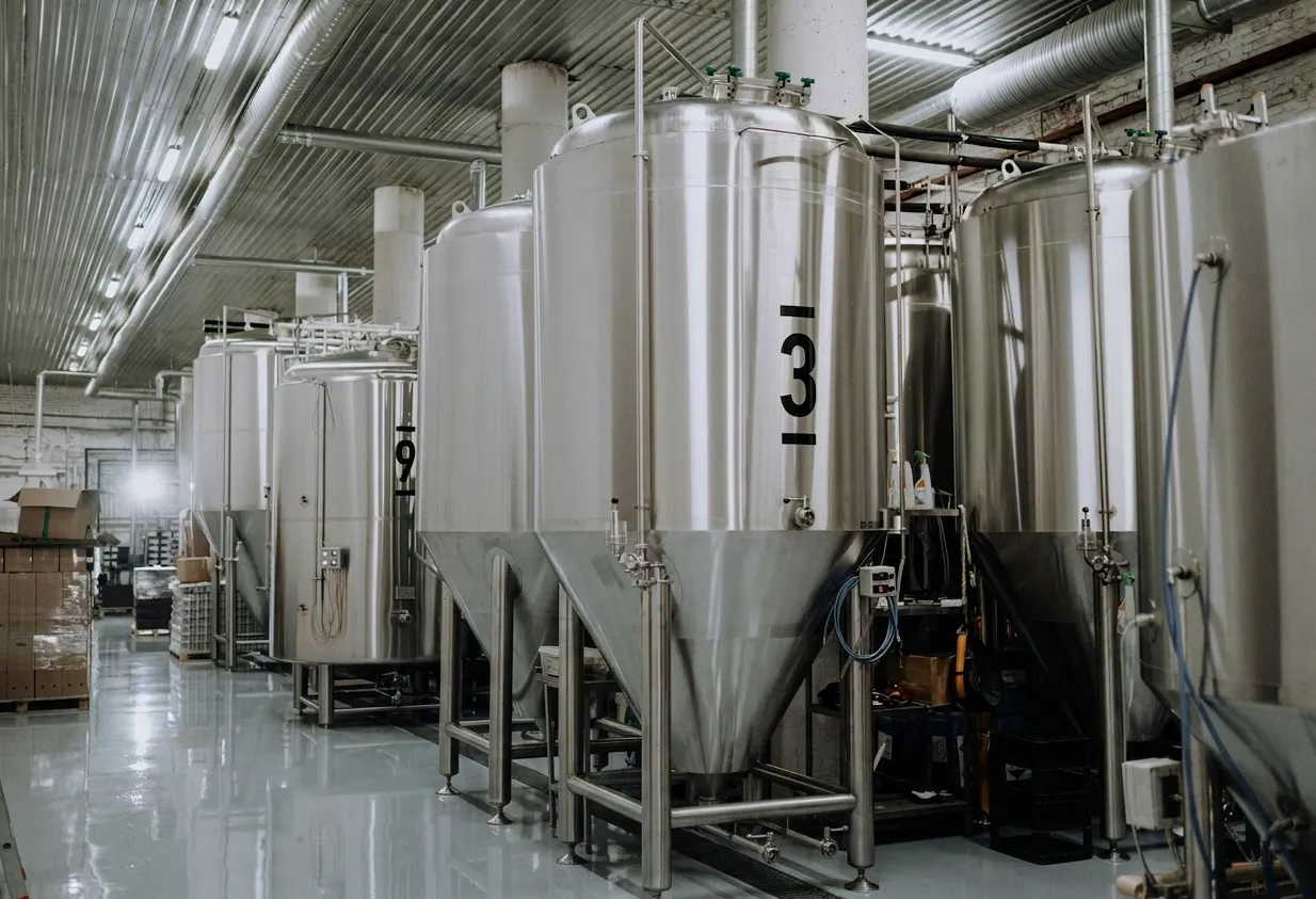 Stainless steel production tanks in modern facility
