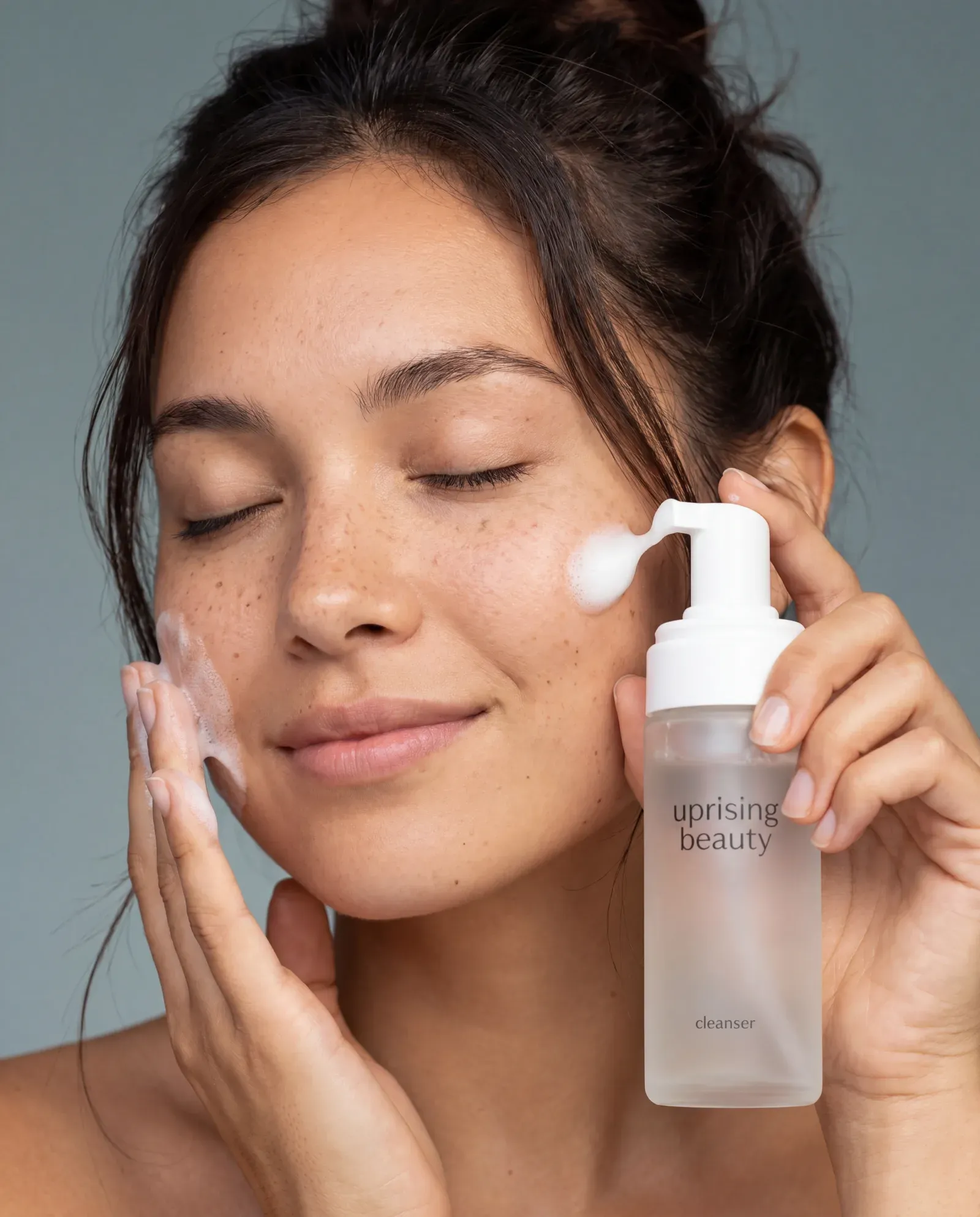 Face care editorial composition, products arranged around a model's face by treatment zone